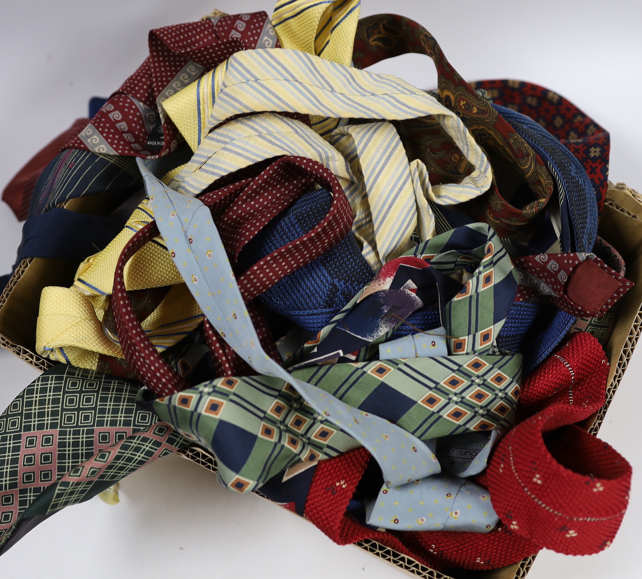 A collection of vintage and later silk ties, some designer including Jaeger, Pierre Cardin, Yves Saint Laurent and Balmain